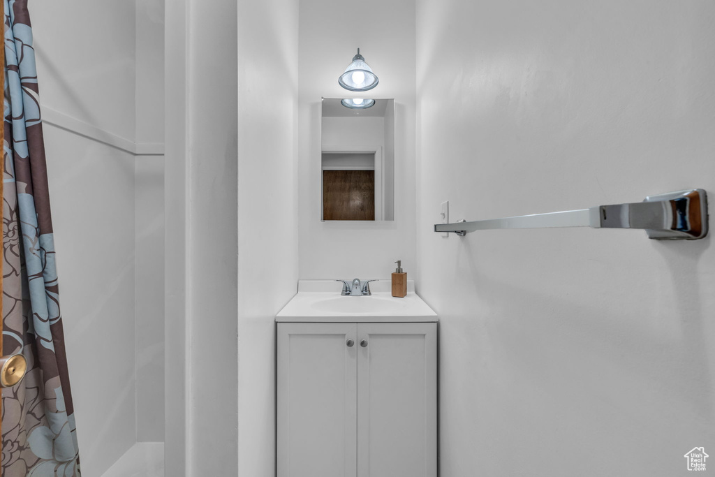 Bathroom with vanity and a shower with shower curtain