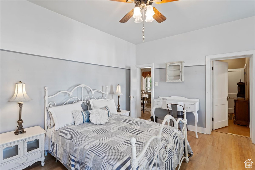 Bedroom with wood finished floors and ceiling fan