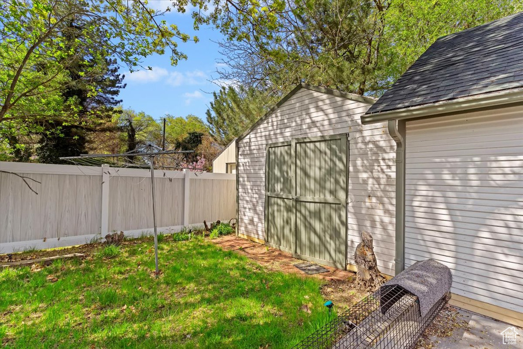 View of shed with fence