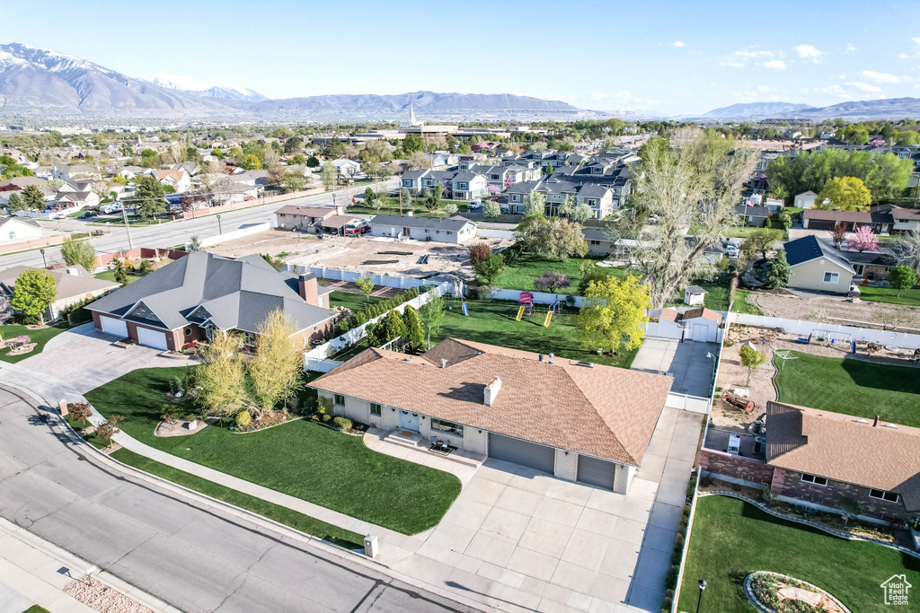 Birds eye view of property with a mountain view and a residential view