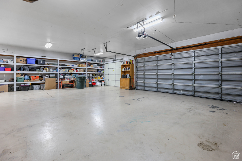 Garage featuring a garage door opener