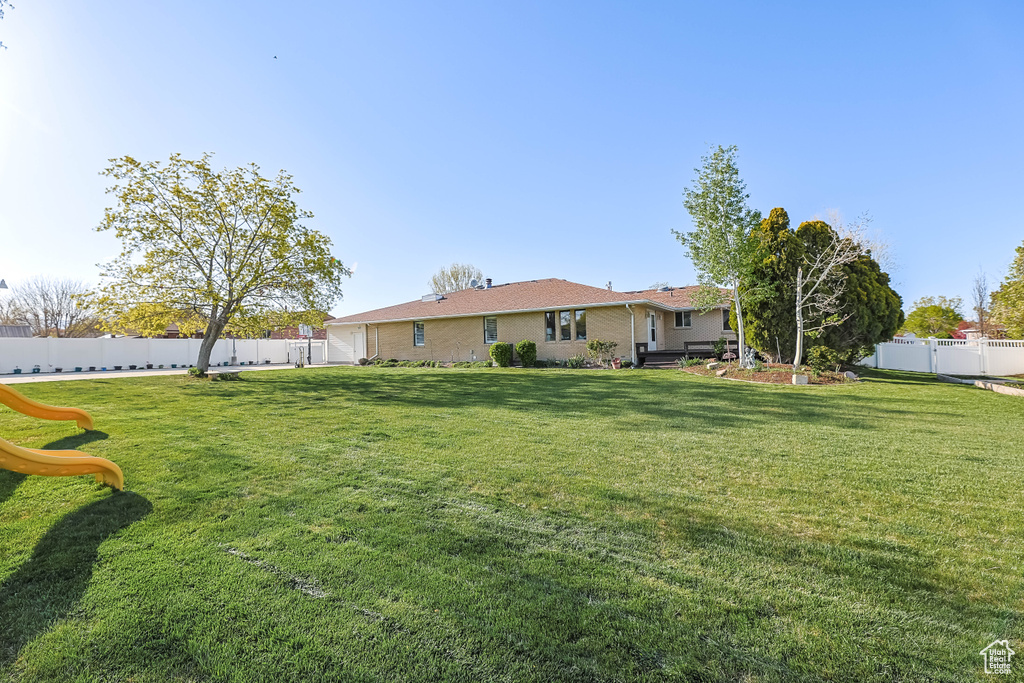 View of yard with a fenced backyard