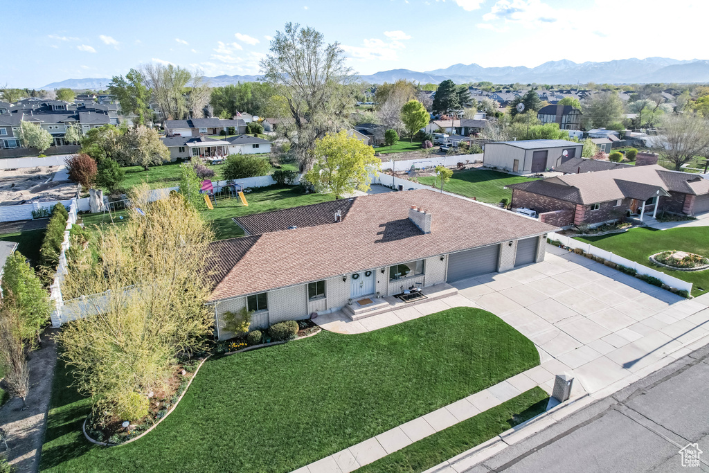 Birds eye view of property with a residential view and a mountain view