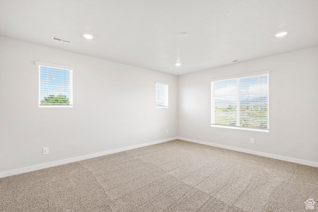 Unfurnished room with recessed lighting, carpet floors, and baseboards