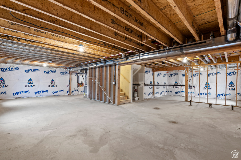 Unfinished basement featuring stairway