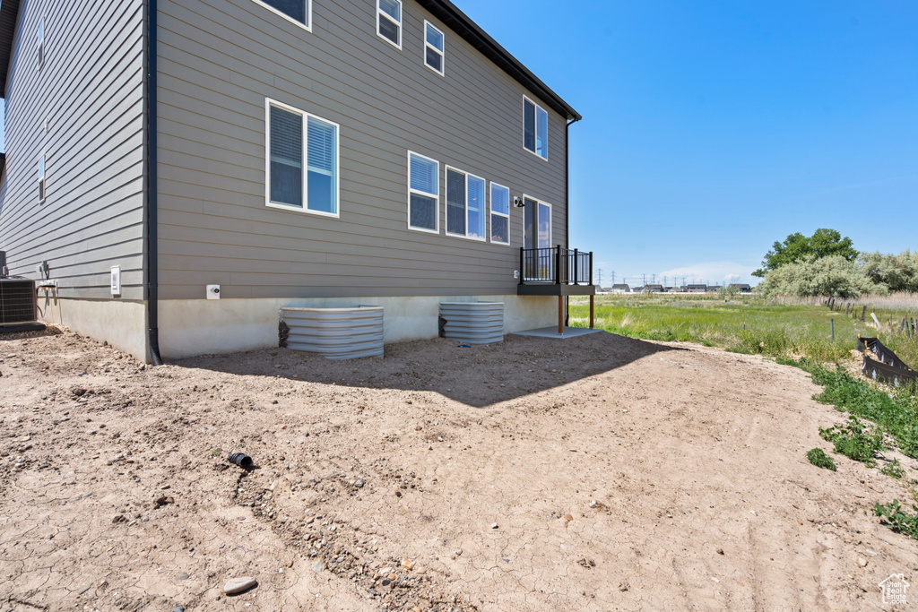 View of home's exterior with central AC unit