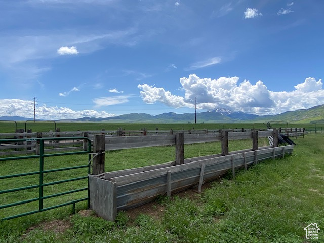 Property view of mountains with a rural view