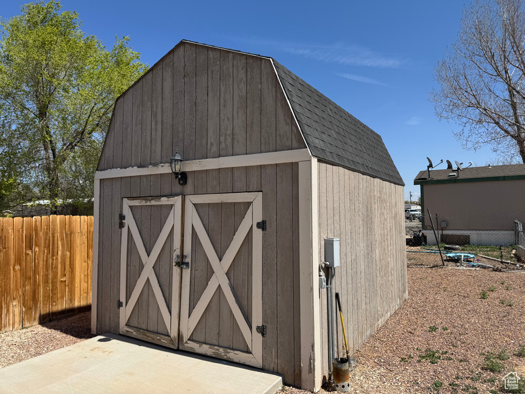 View of shed with fence
