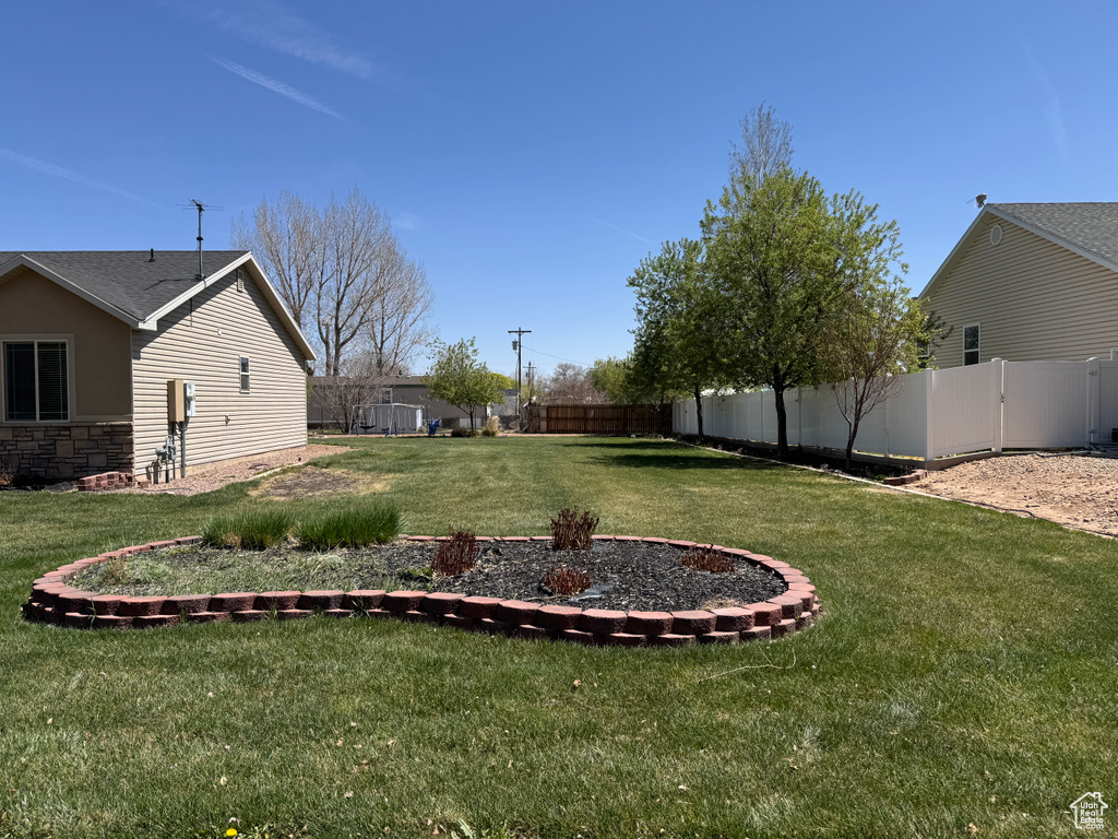 View of yard featuring fence