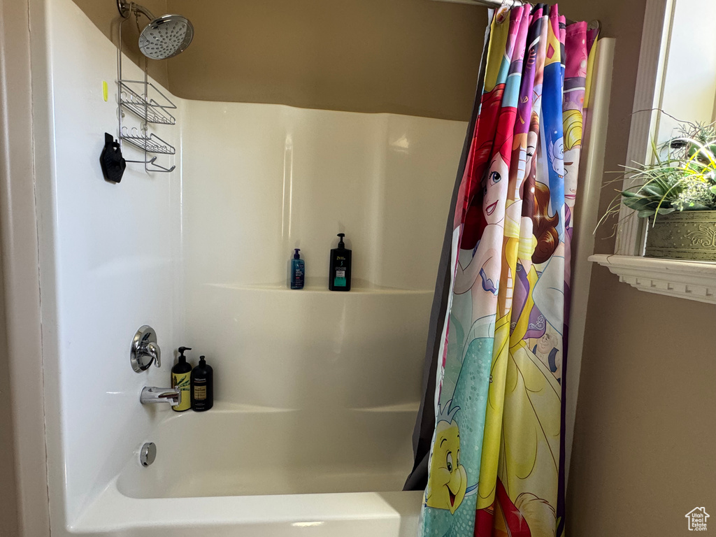 Bathroom featuring shower / bath combo