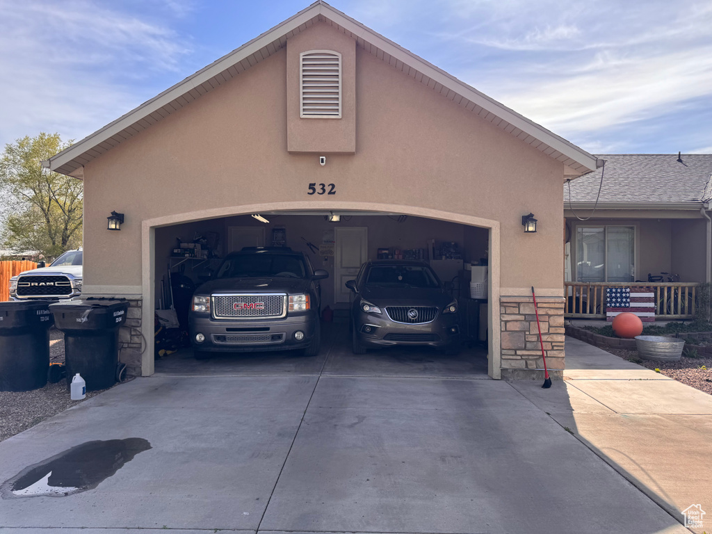 Garage with concrete driveway