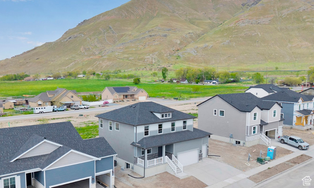 Aerial view of residential area featuring a mountainous background
