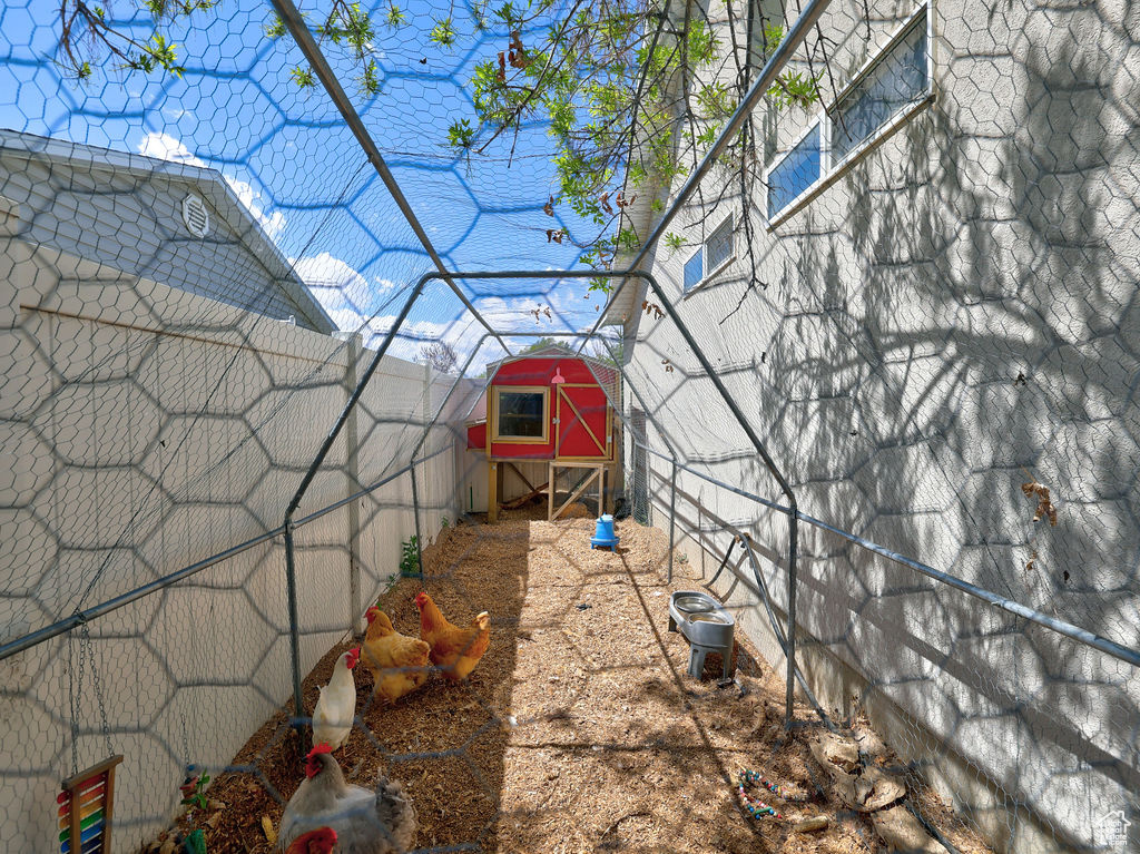 View of yard with exterior structure, an outdoor structure, and fence private yard