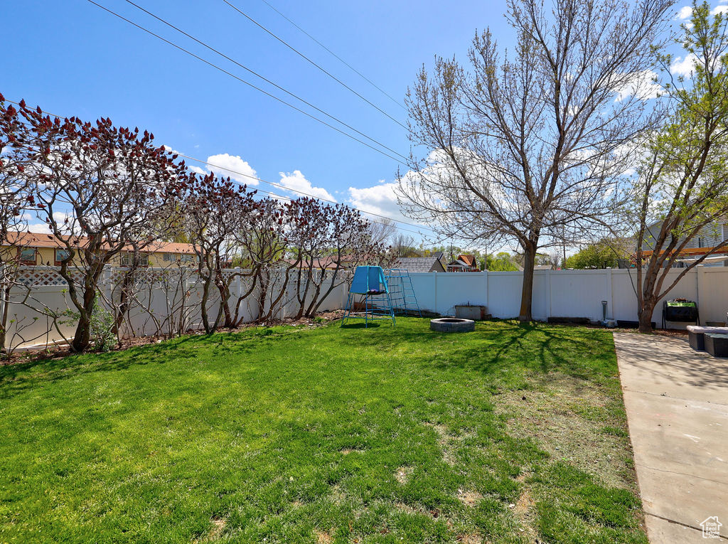 View of yard with a fenced backyard