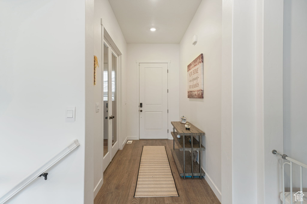 Hallway with recessed lighting, baseboards, and dark wood finished floors