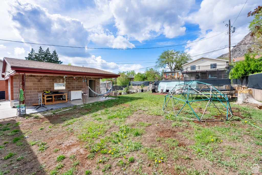 View of yard featuring fence