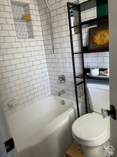 Full bath with toilet and shower / washtub combination