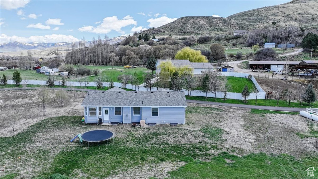 Birds eye view of property featuring a mountain view