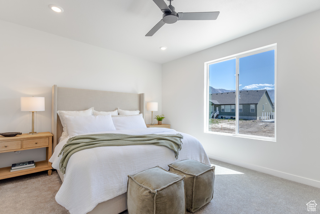 Bedroom with carpet flooring, baseboards, ceiling fan, and recessed lighting