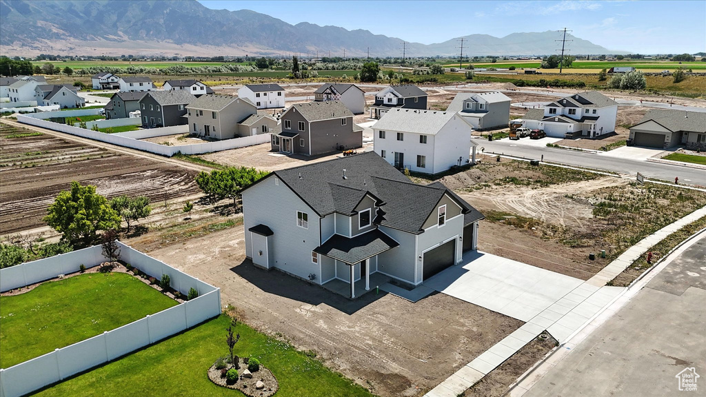 Aerial perspective of suburban area with a mountainous background