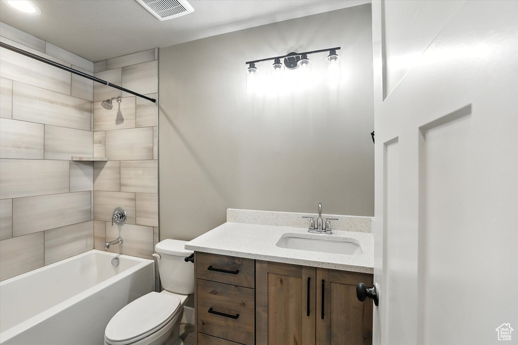 Full bath with bathing tub / shower combination and vanity