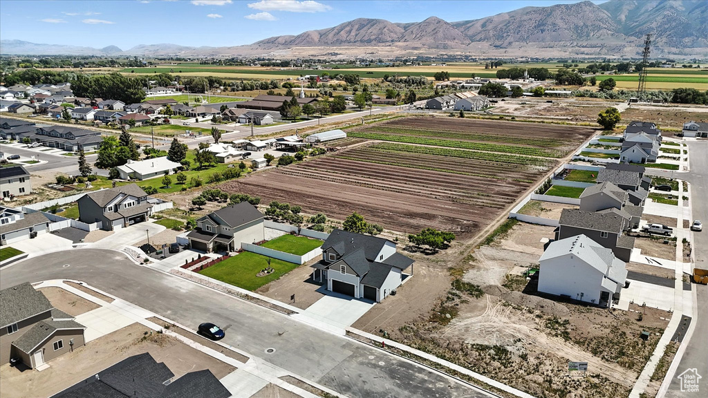 Aerial perspective of suburban area with a mountainous background