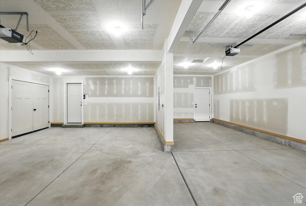 Garage featuring a garage door opener