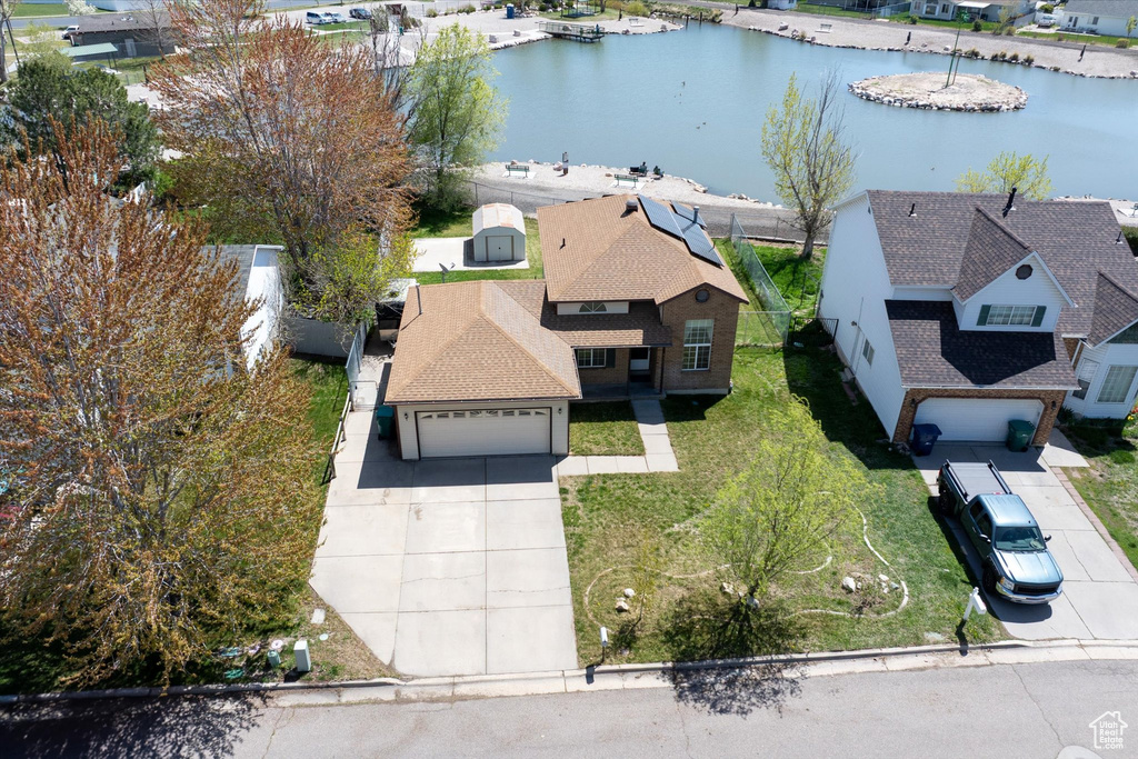 Bird's eye view featuring a water view and a residential view