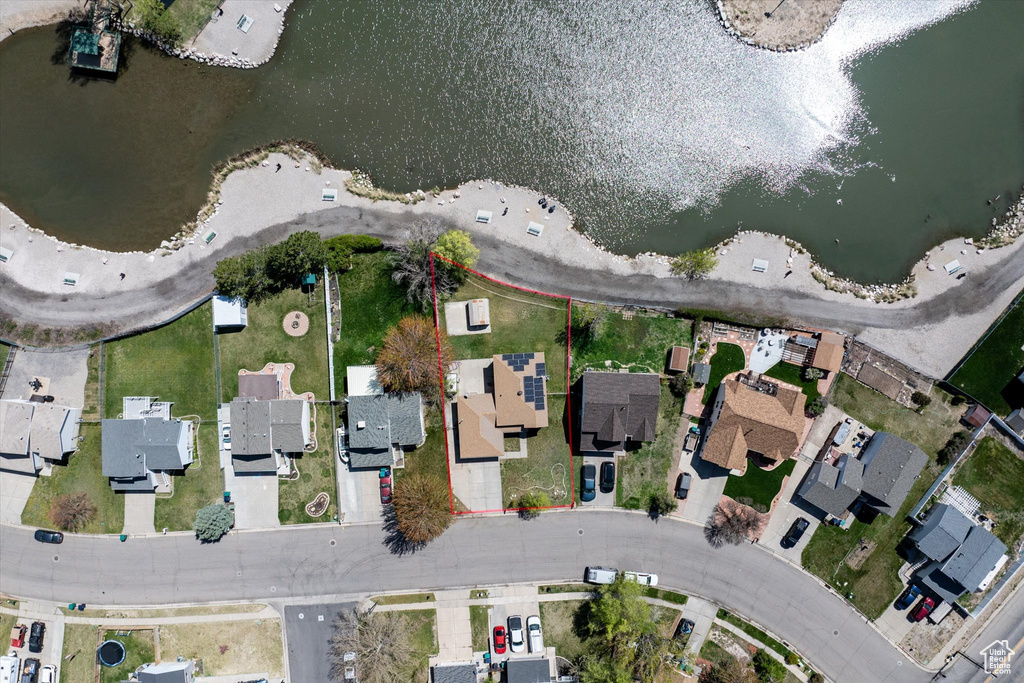 Bird's eye view featuring a water view and a residential view