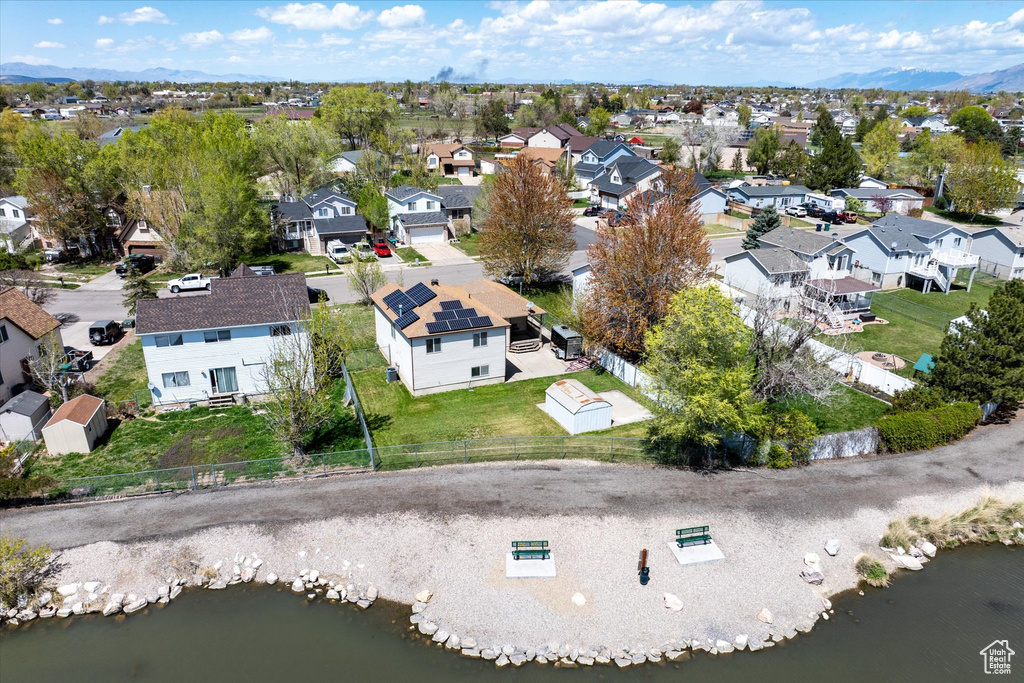 Aerial view featuring a residential view and a water and mountain view