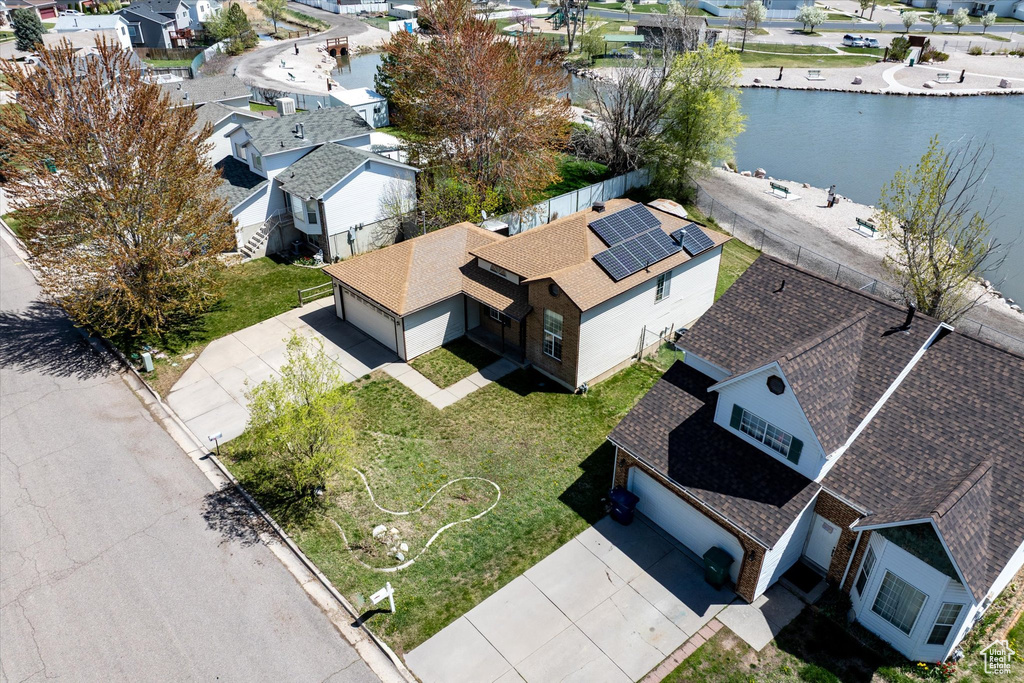Aerial view featuring a residential view and a water view