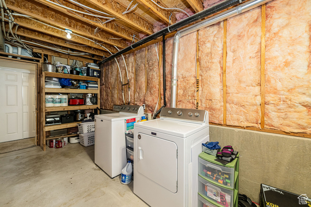 Laundry room with independent washer and dryer and laundry area