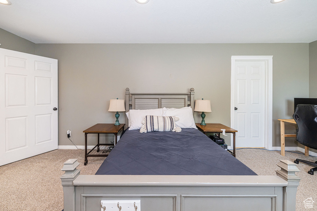 Carpeted bedroom featuring baseboards and recessed lighting