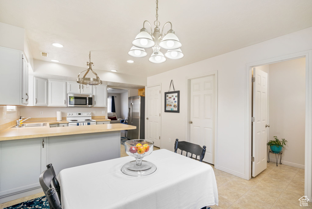 Dining space featuring recessed lighting, a chandelier, light tile patterned floors, baseboards, and visible vents