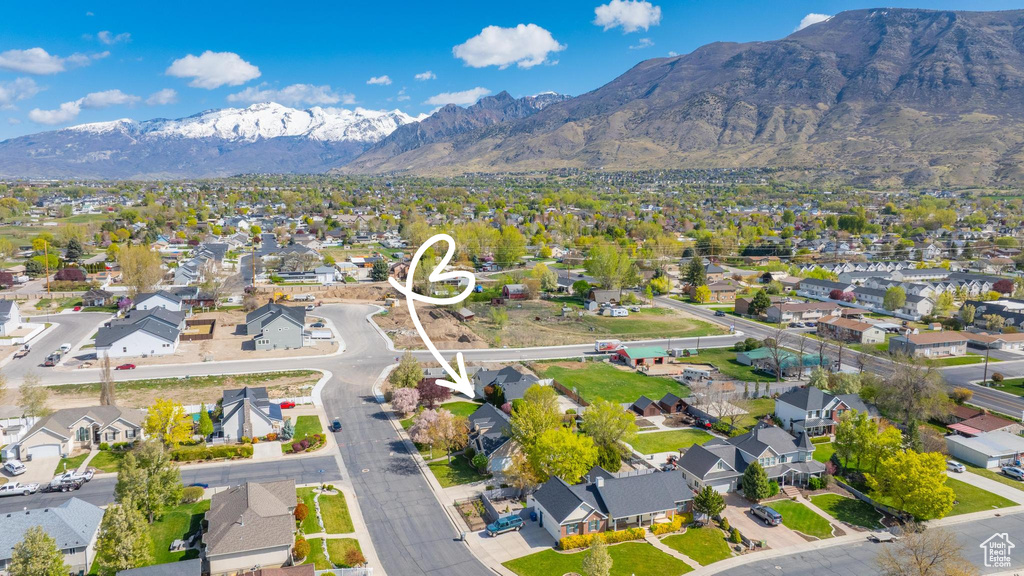 Birds eye view of property with a residential view and a mountain view