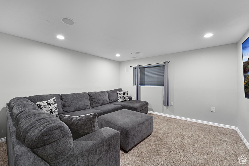 Living room with baseboards, carpet, and recessed lighting