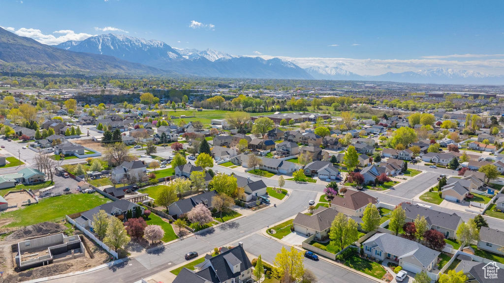 Birds eye view of property with a residential view and a mountain view