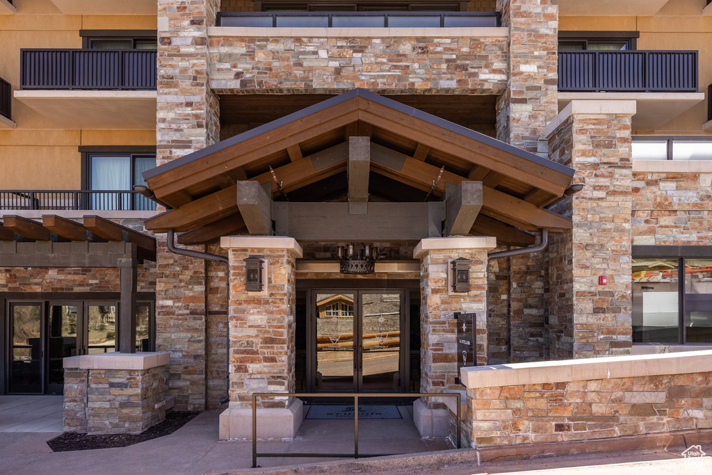 Property entrance with stone siding