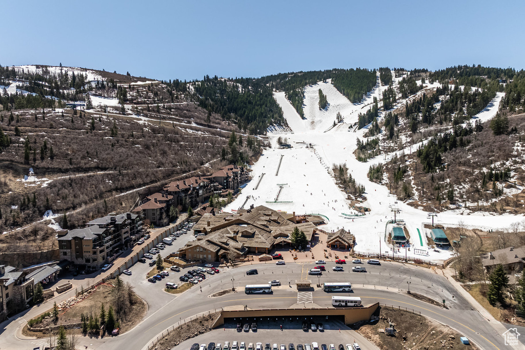 Snowy aerial view featuring a mountain view