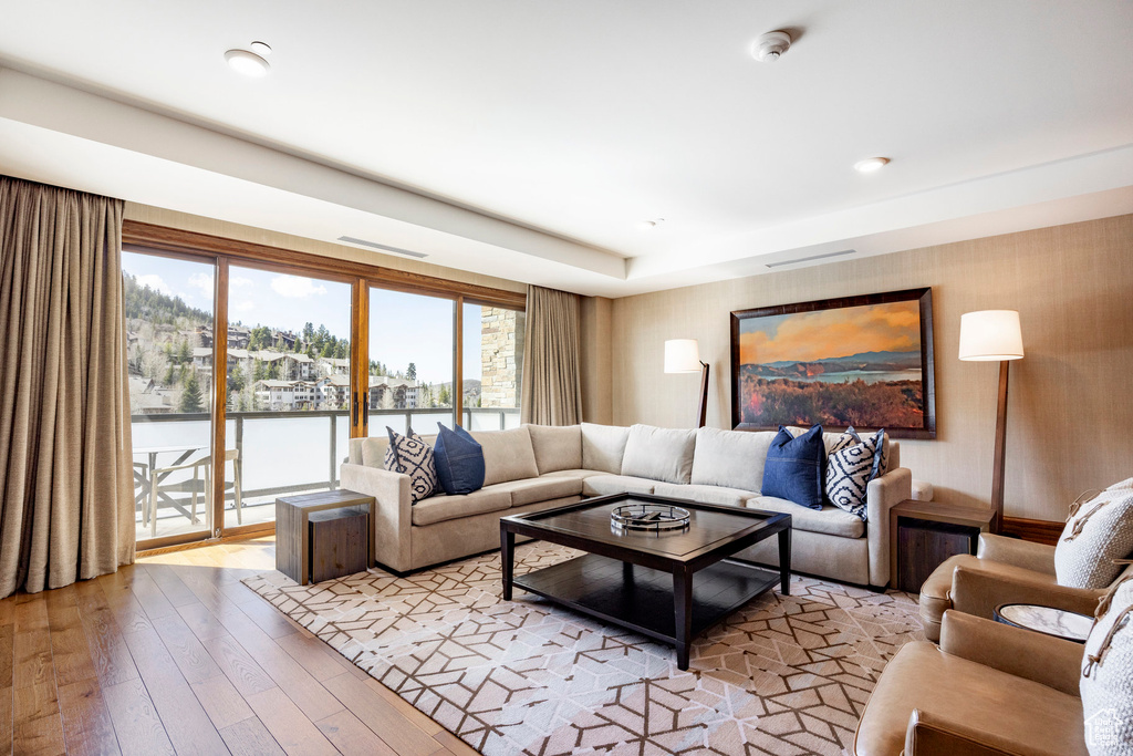 Living room featuring visible vents and light wood-style floors