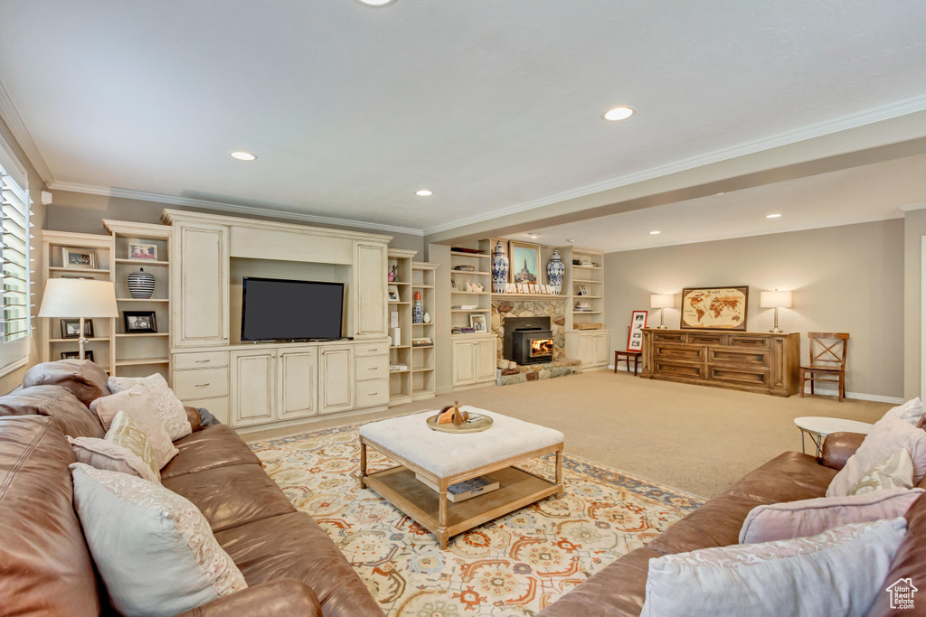 Living room with recessed lighting, baseboards, and ornamental molding