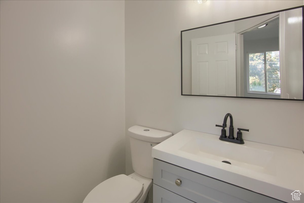 Bathroom with vanity and toilet