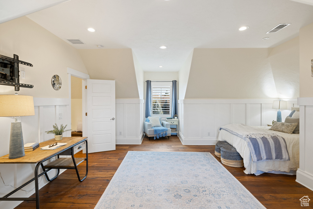 Bedroom with dark wood-type flooring and visible vents
