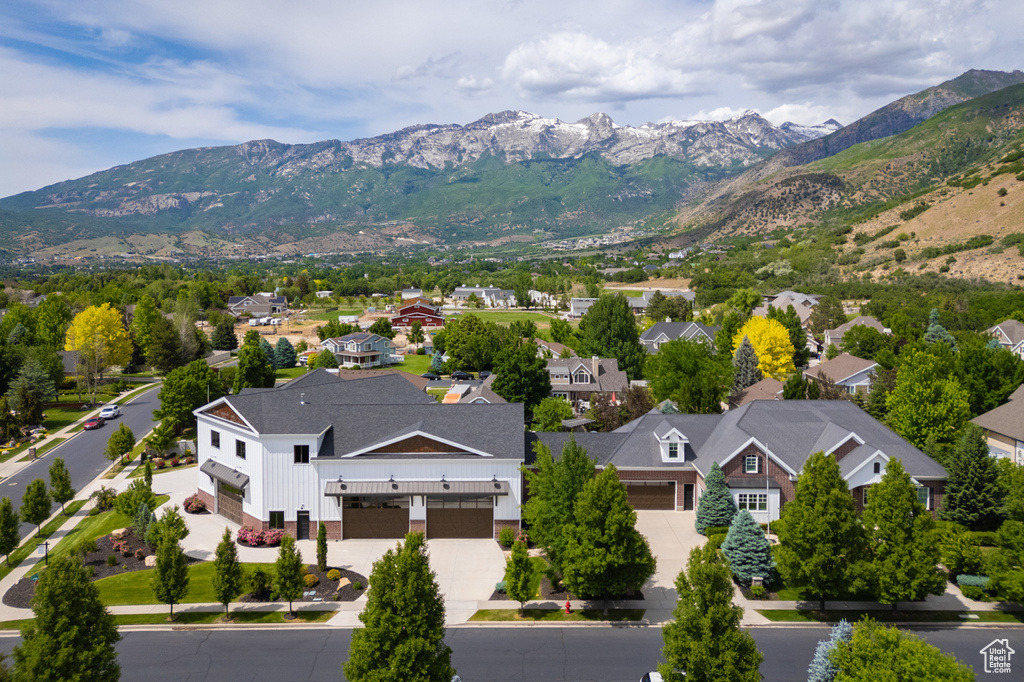 View of mountain backdrop featuring nearby suburban area