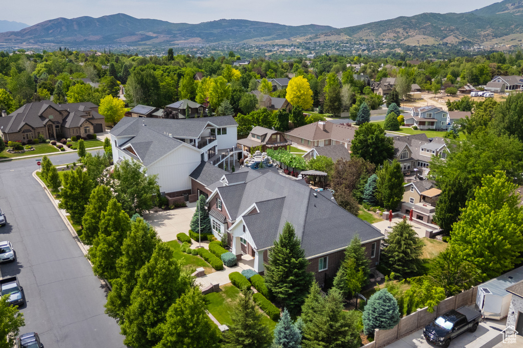 Aerial perspective of suburban area featuring a mountain backdrop