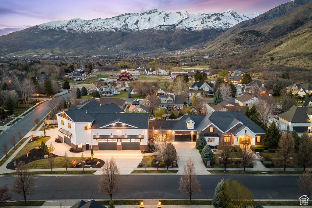 Aerial view at dusk featuring a residential view and a mountain view