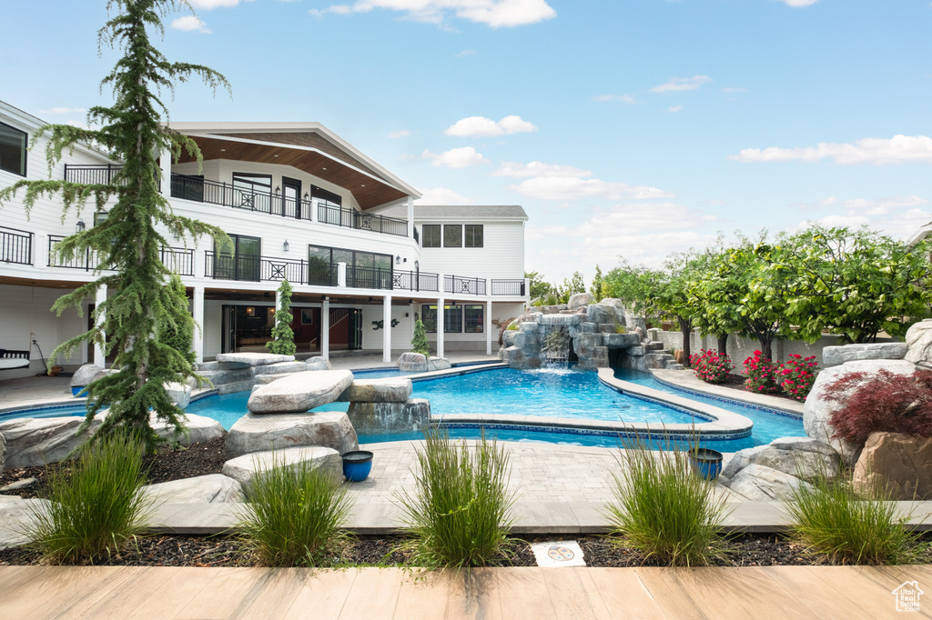 Swimming pool with an in-ground hot tub