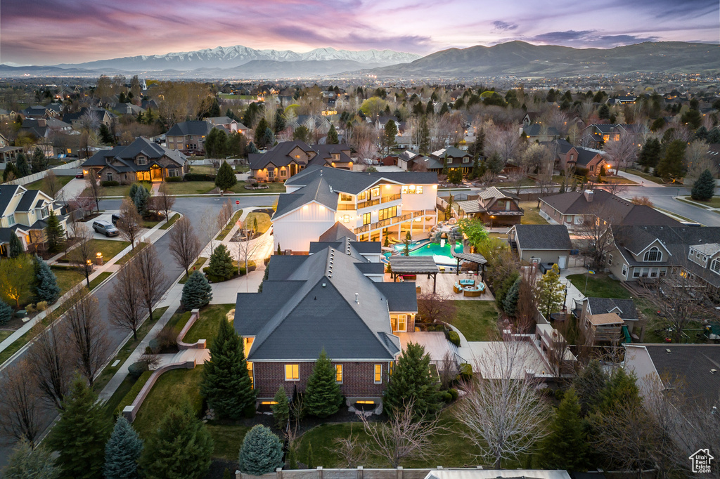 Aerial view at dusk with a residential view and a mountain view