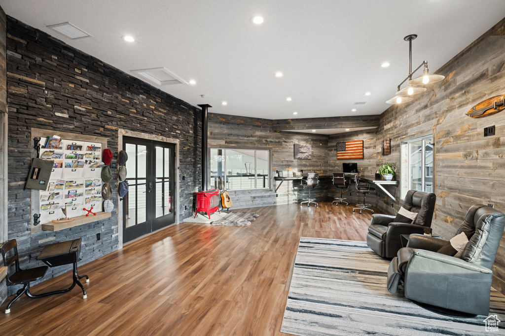 Living room with french doors, wood finished floors, visible vents, and recessed lighting