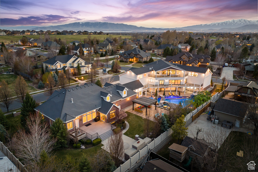 Aerial view at dusk with a mountain view and a residential view